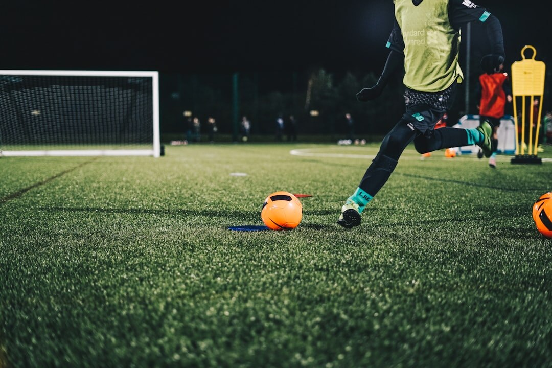 football player training with kids